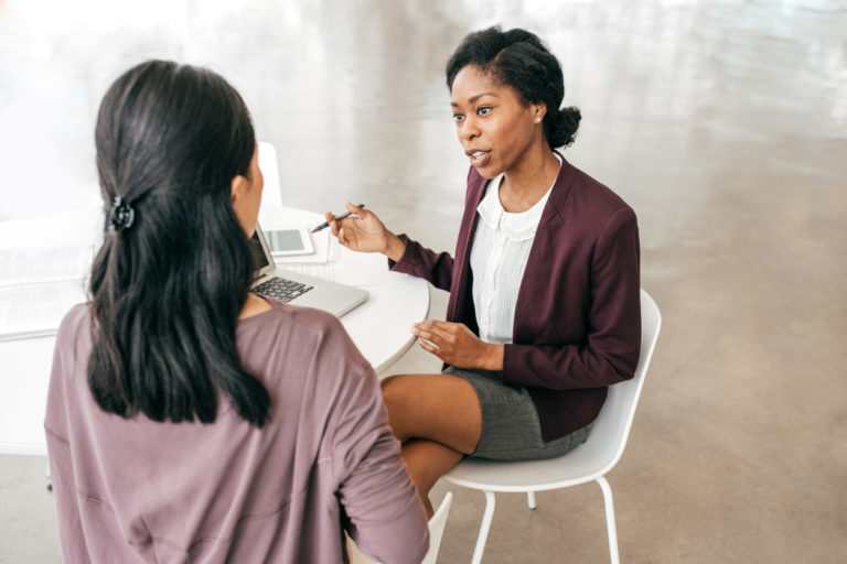 Two woman discussing new strategy