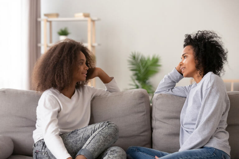 Parent and teenage daughter talking about car accidents.