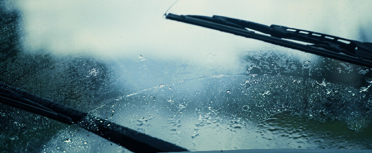 rainy windshield with wipers vehicle defects