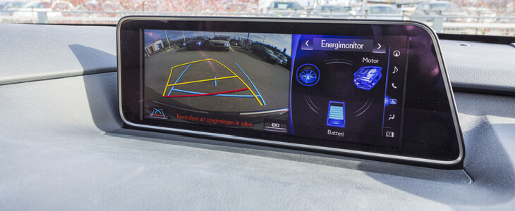 the backup camera shown on a screen inside of a car