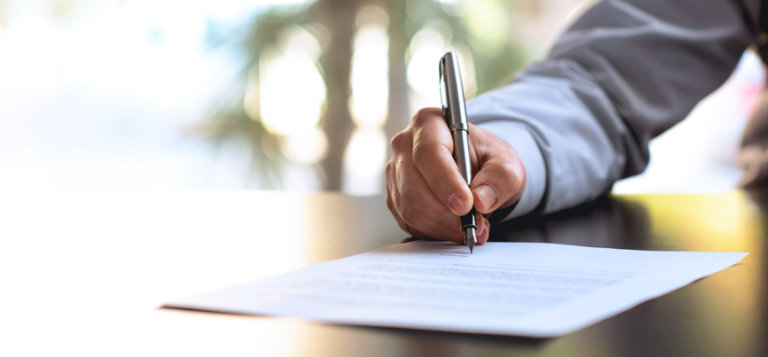 Attorney signing legal document