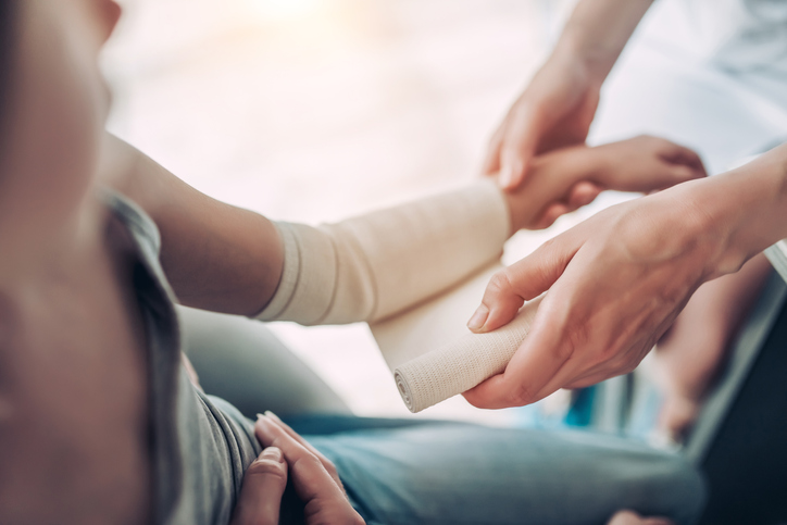 Person treating arm wound