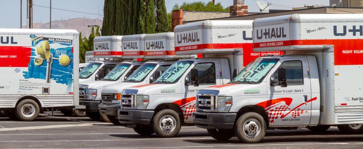 U-Haul trucks parked in an empty lot for rent