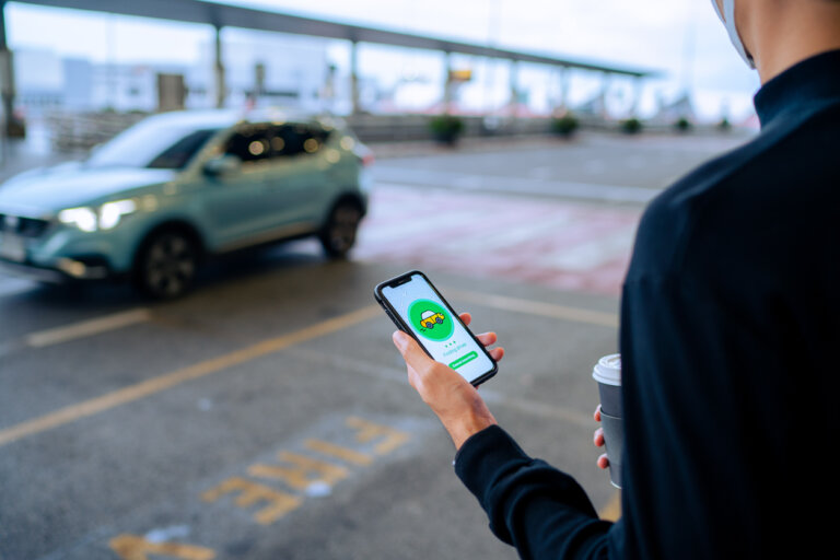 man waiting for rideshare vehicle