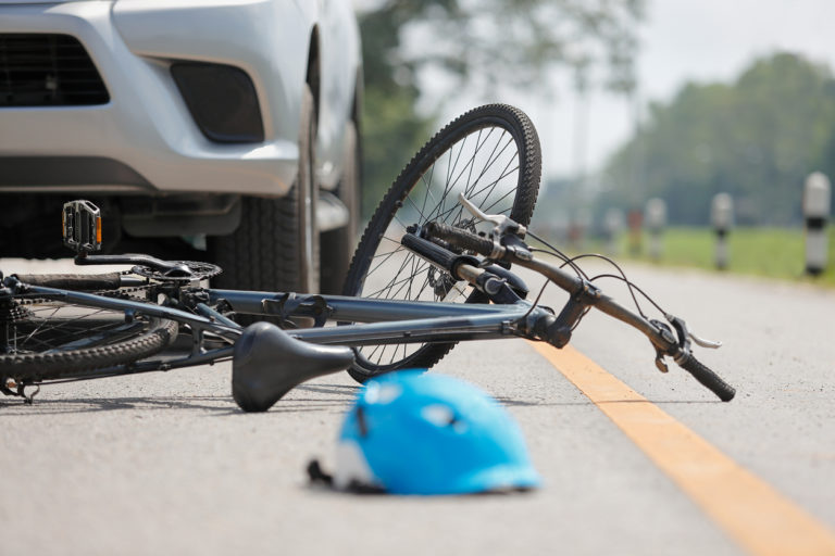 car crash with bicycle on road