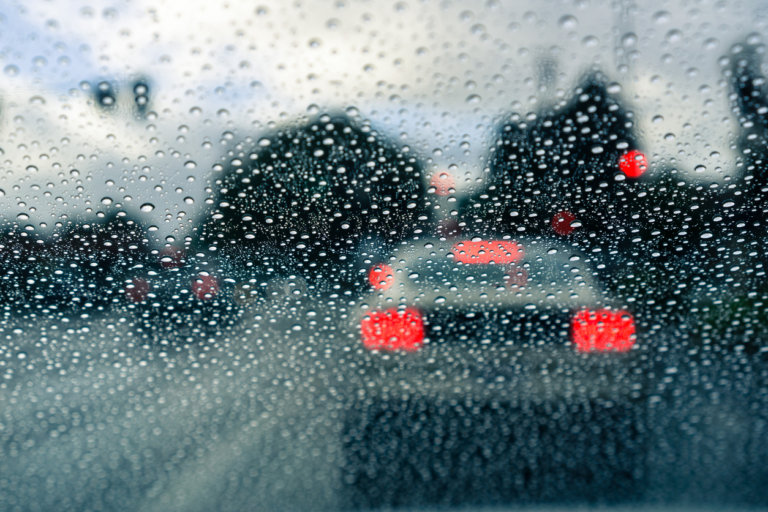Car driving in light rain.
