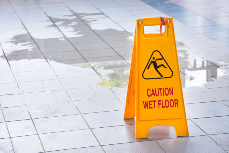 Wet floor sign to prevent slip and fall injuries.