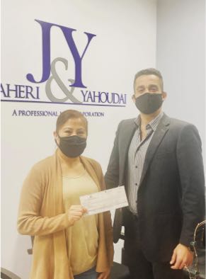Yosi and client with settlement check