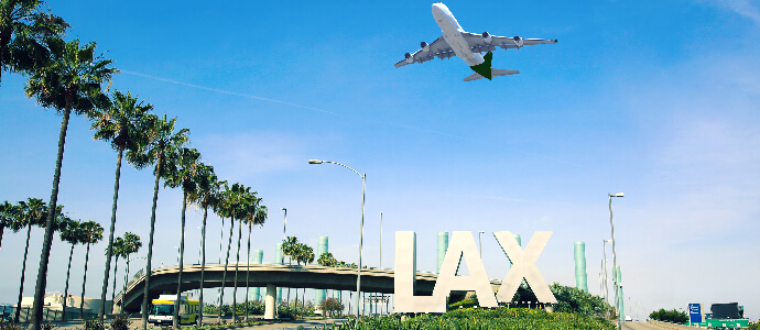 Los Angeles Airport sign full highway with airplane flying overhead, airplane accident
