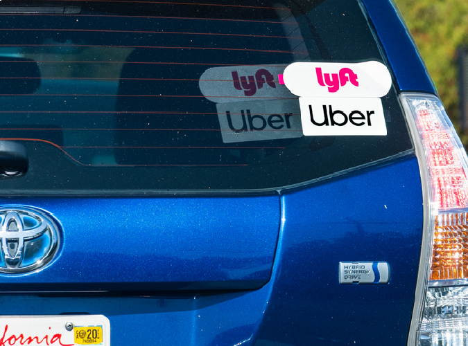 Uber & Lyft sticker on a car with a California license plate