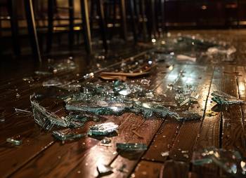 broken glass on a bar room floor after a bar fight