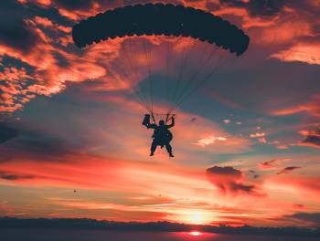 sky diver with their parachute open