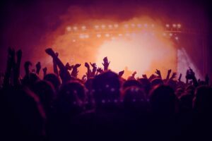 Concert-goers raise their fists as they wonder what to do if your information was exposed in the Ticketmaster Live Nation data breach.