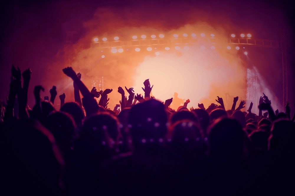 Concert-goers raise their fists as they wonder what to do if your information was exposed in the Ticketmaster Live Nation data breach.