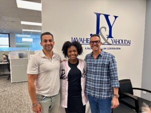 A group photo with J&Y Law Distracted Driving Scholarship Winner, Moriah Mosley with Yosi Yahoudai and Jason Javaheri in their office.