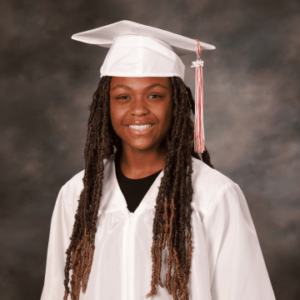 A professional photo of J&Y Law Distracted Driving Scholarship Winner, Moriah Mosley, in a graduation cap and gown.